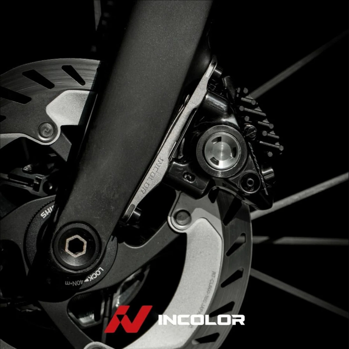 Incolor titanium front brake mount fitted to a fork